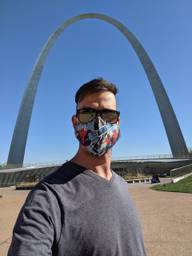 Alex infront of the Gateway arch wearing Spiderman breathing mask